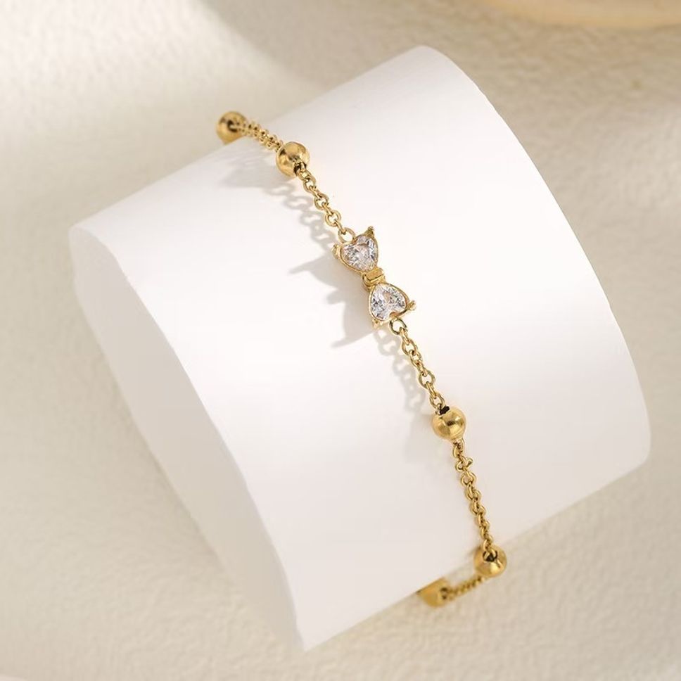 MYKI Gold-Plated Bow Crystal Charm Bracelet(MKBRAD857G-SSYI)