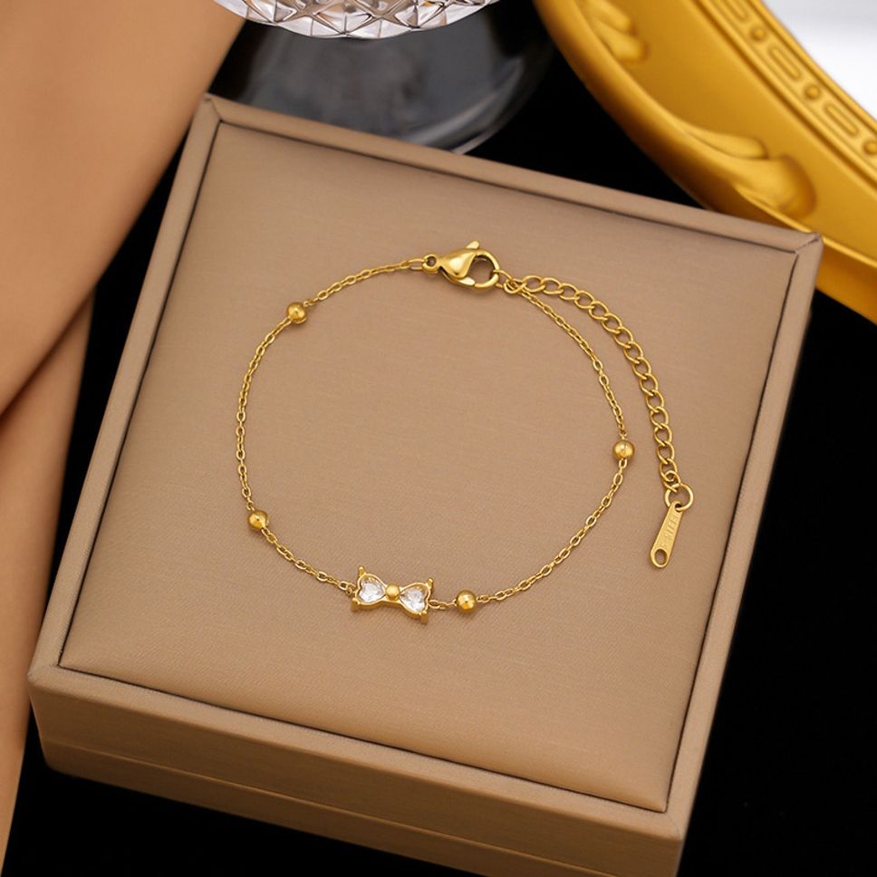 MYKI Gold-Plated Bow Crystal Charm Bracelet(MKBRAD857G-SSYI)