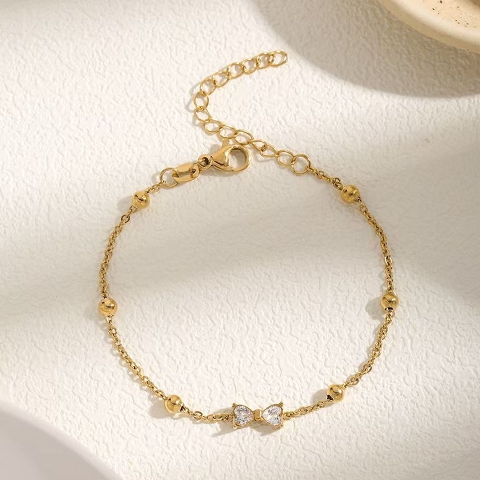 MYKI Gold-Plated Bow Crystal Charm Bracelet(MKBRAD857G-SSYI)