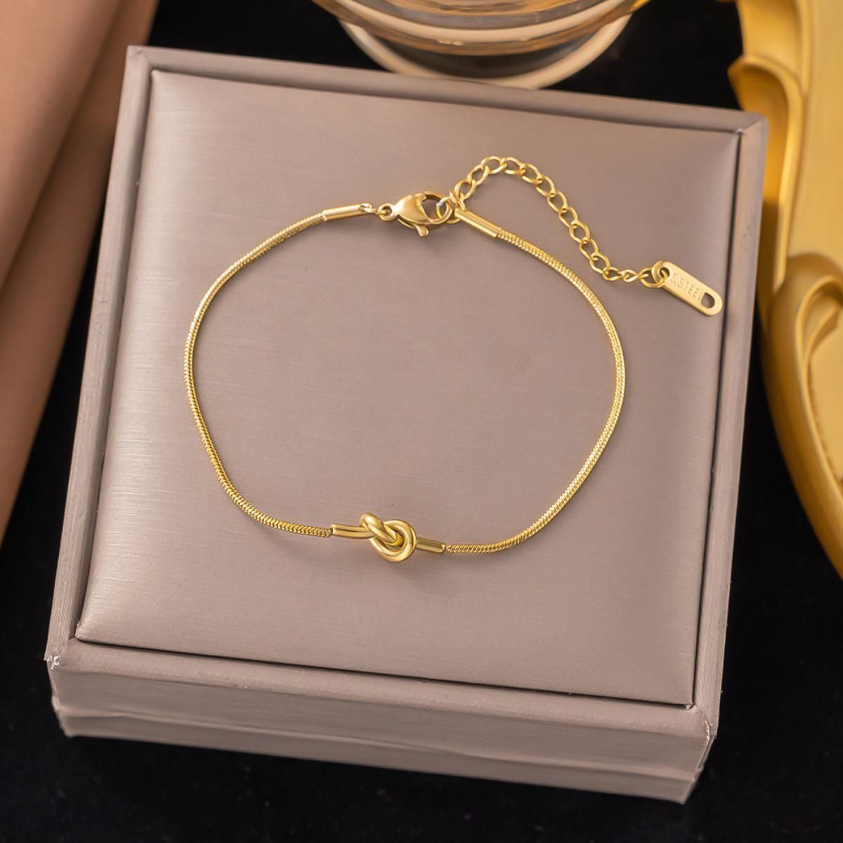 MYKI Minimal Knot Shape Sleek Daily Wear Anklet for Women – Gold Color Premium Plated (MKANK701G-SSYI)