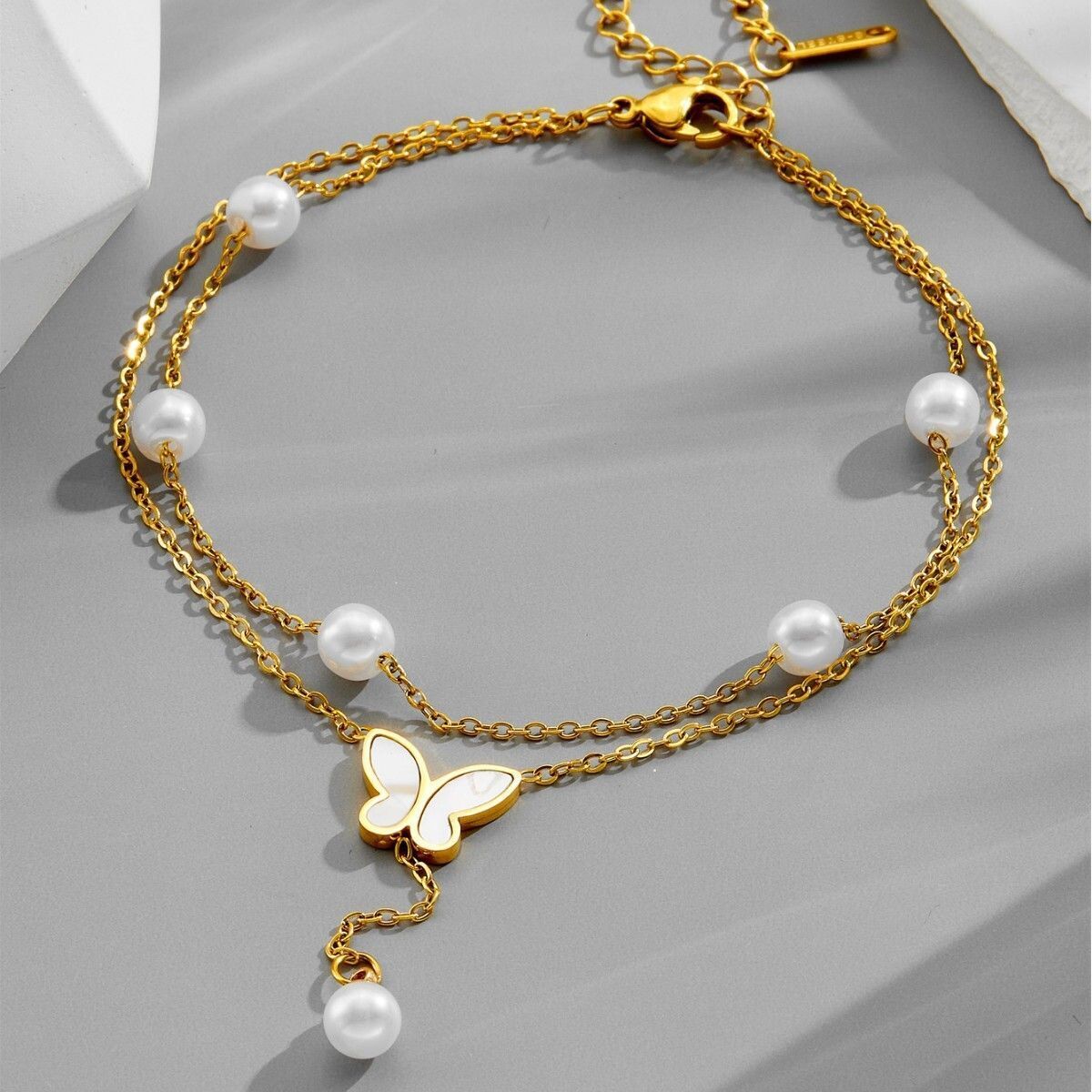 MYKI Butterfly Shape Pearl Drop Layered Anklet for Women – Gold & White Color Premium Plated (MKANK724G-SSYI)