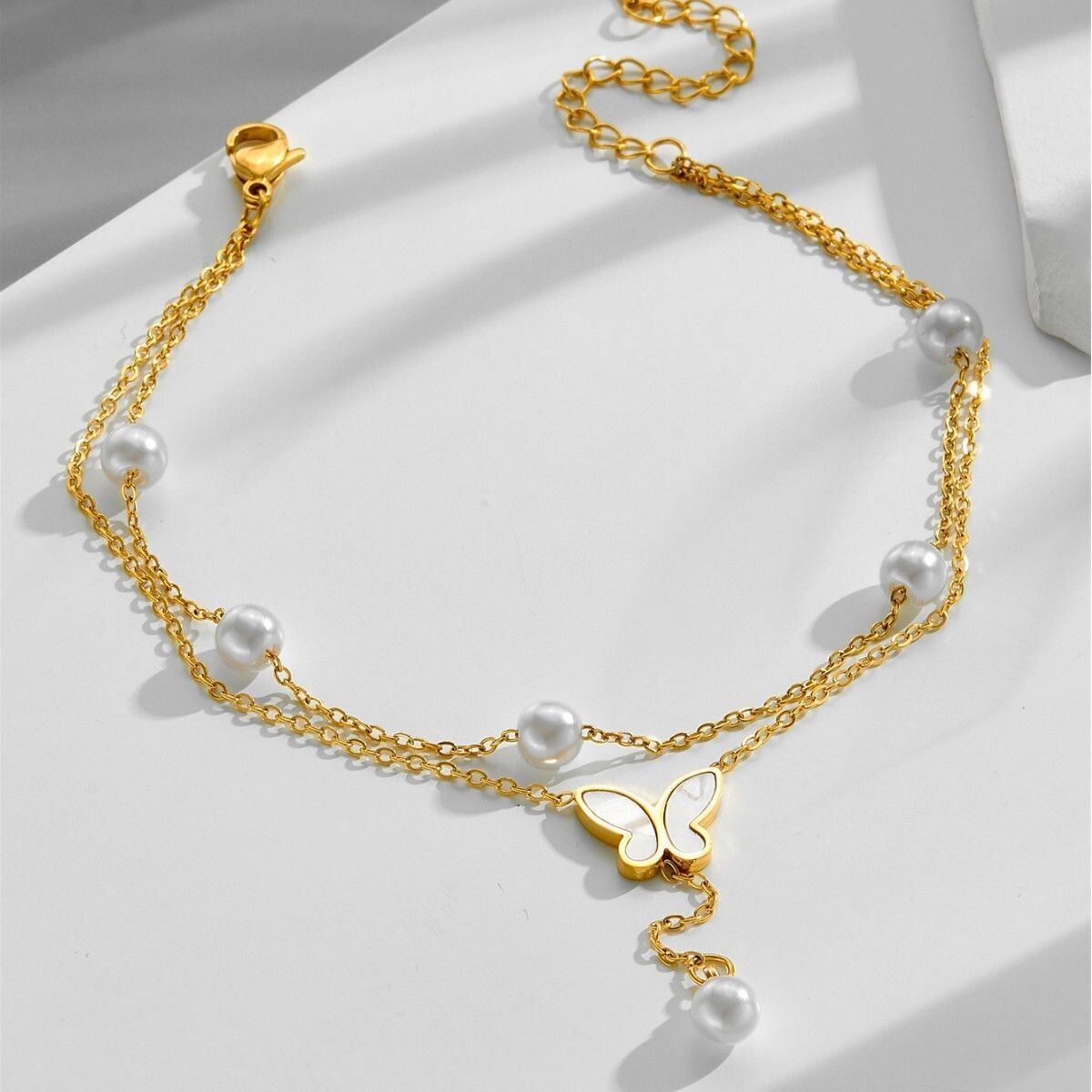 MYKI Butterfly Shape Pearl Drop Layered Anklet for Women – Gold & White Color Premium Plated (MKANK724G-SSYI)