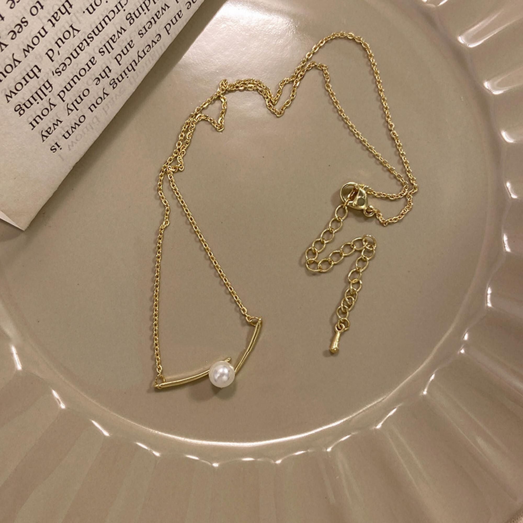MYKI Anti-Tarnish Stainless Steel Gold Plated Pearl Accent Bar Necklace (MK791G-SSYI)